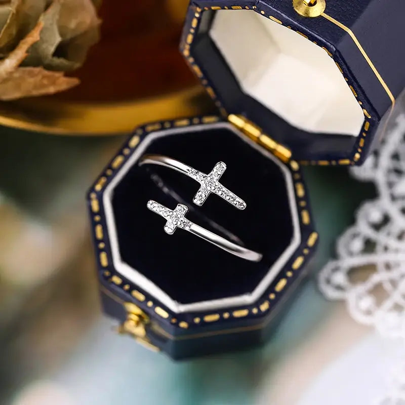 Double Christian cross ring with diamonds on blue box