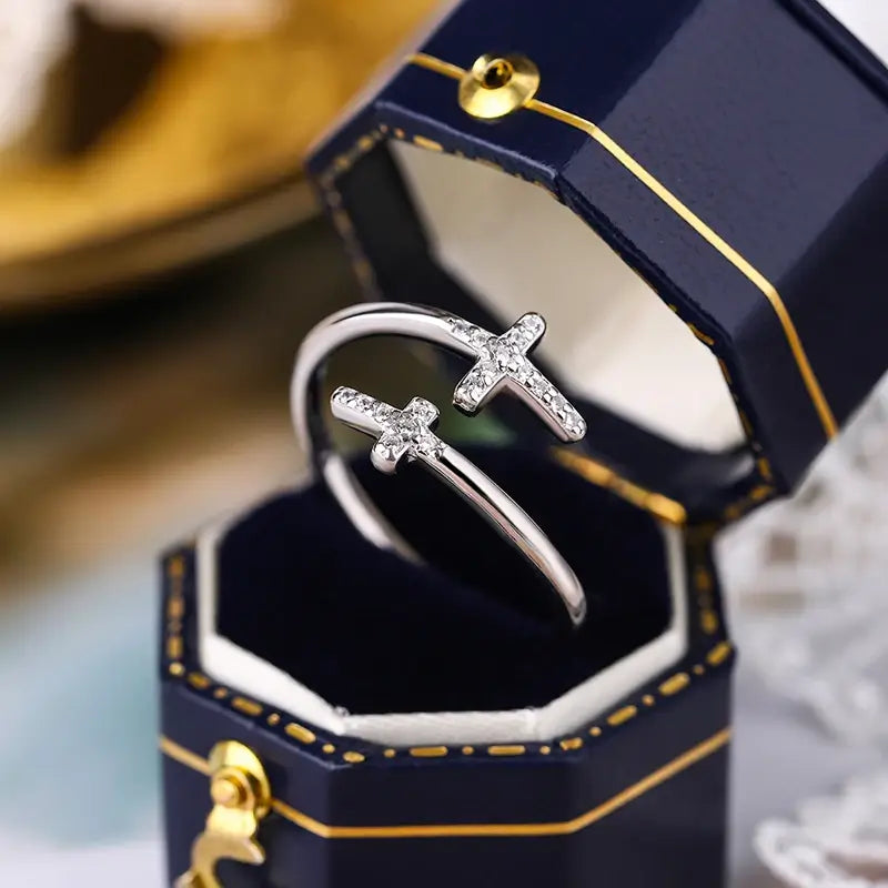 Double Christian cross ring with diamonds on blue box