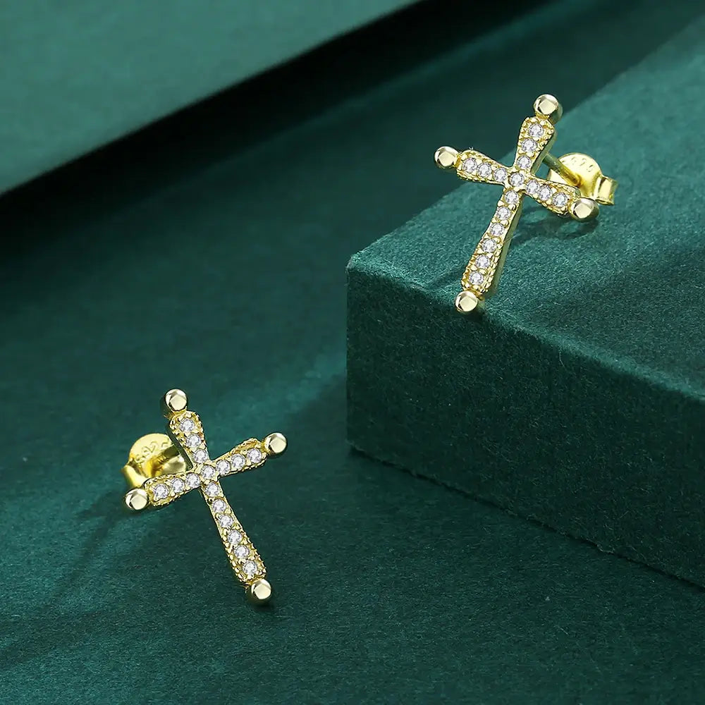 Earrings with a Christian cross in gold on green background