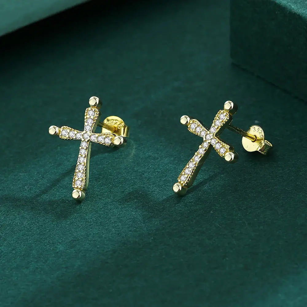 Earrings with a Christian cross in gold on green background